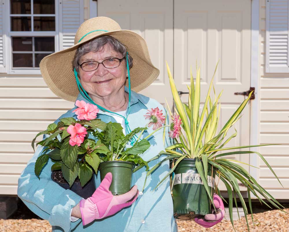 A resident enjoys her gardening time